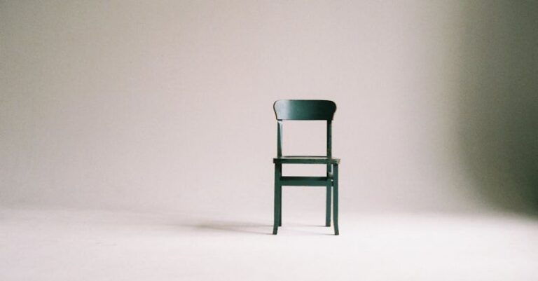 Minimalism - Wooden Chair on a White Wall Studio