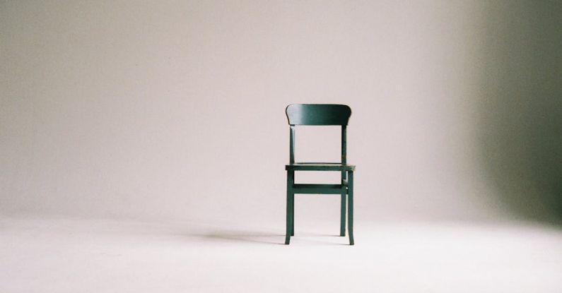Minimalism - Wooden Chair on a White Wall Studio