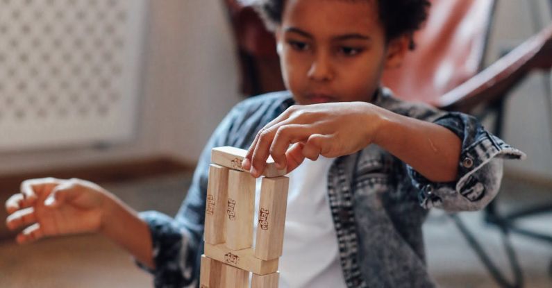 Creative Blocks - Boy Holding Jenga Block