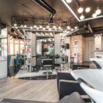 Wellness Trends - Backwash chairs with sinks placed in spacious modern beauty salon with stylish design and various cosmetology products with professional equipment