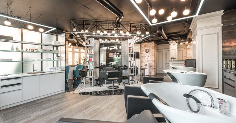 Wellness Trends - Backwash chairs with sinks placed in spacious modern beauty salon with stylish design and various cosmetology products with professional equipment