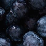 Plant-based Diets - Top view of delicious sweet and fresh ripe blueberries placed on even surface