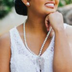 Lateral Thinking - A beautiful young woman in a white dress sitting on a rock