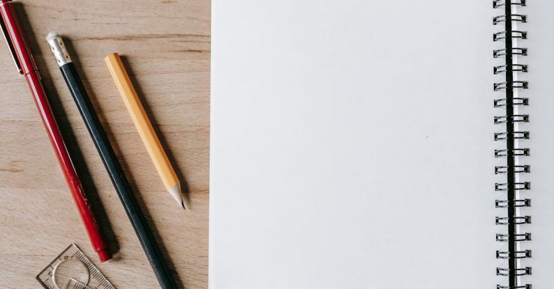 Classroom Design - Pencils and rulers near notebook on table