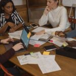 International Space Regulations - Interracial Group of People Discussing at the Table