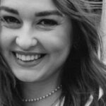 Bilingual Education - A black and white photo of a woman in a graduation gown