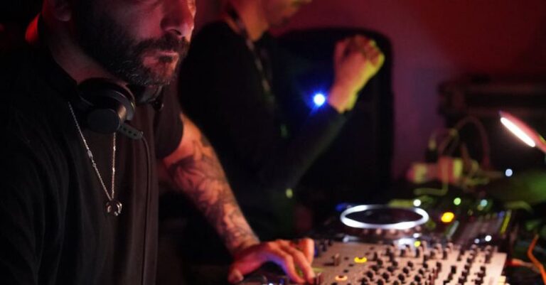 Gene Editing - A man with a beard and tattoos playing music