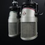 Battery Technology - Two Gray Condenser Microphones