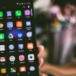 Mobile Technology - Selective Focus Photography of Person Holding Turned on Smartphone