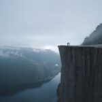 Edge Computing - Two People On Mountain Cliff